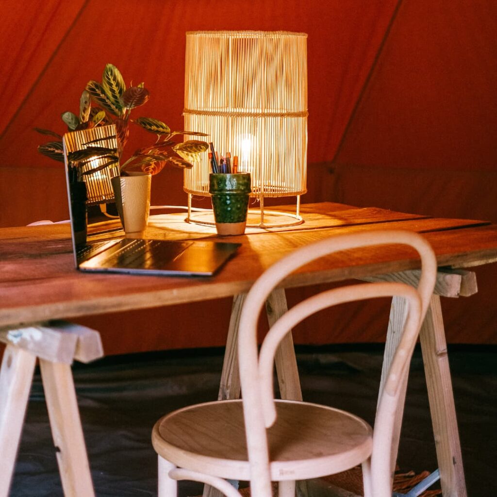 Autentic | Luxury Glamping Bell Tents - Autentic 5m Jack Bell Tent used as a home office with a desk and laptop