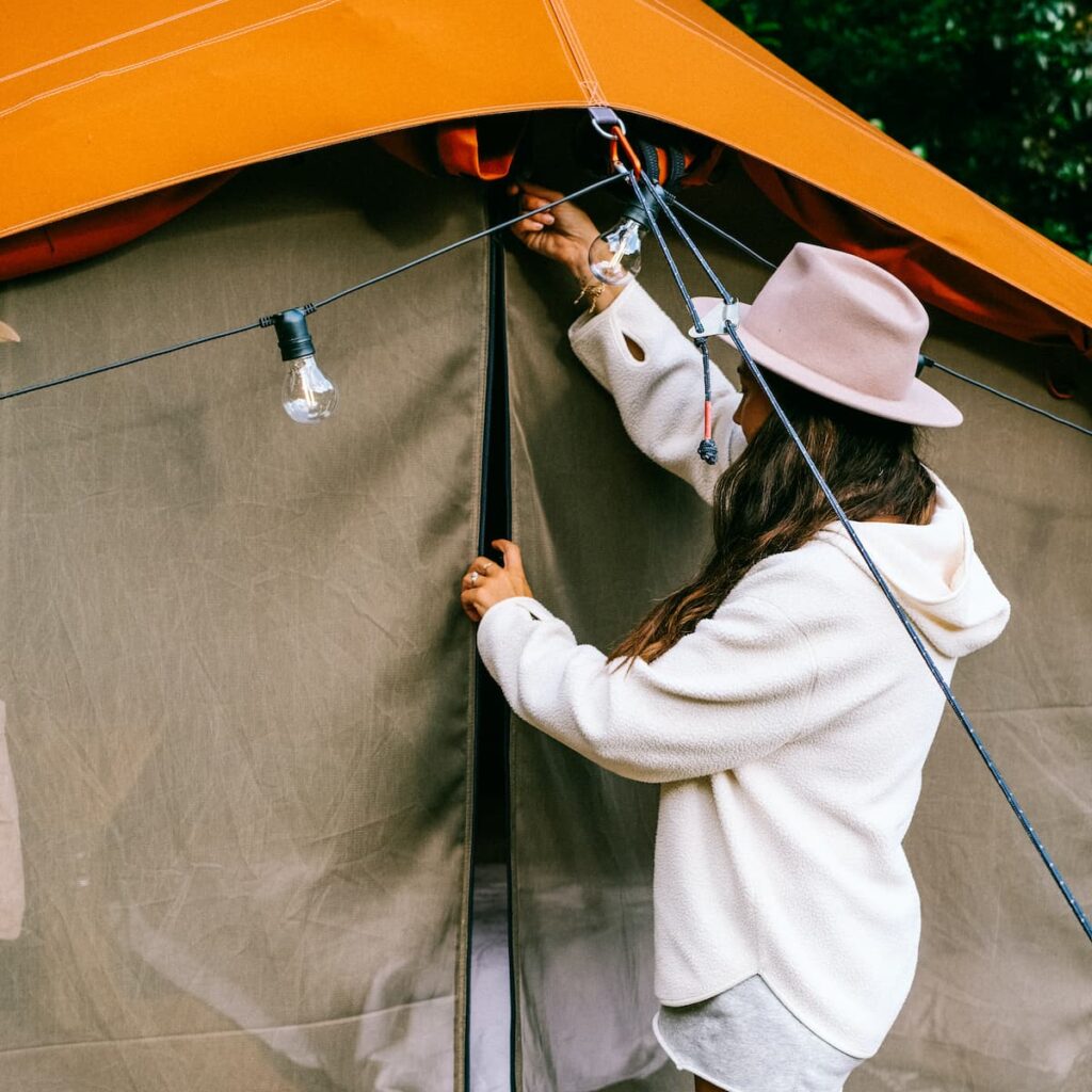 Autentic | Luxury Glamping Bell Tents - @these_arethe_days closing the mesh doors of her Autentic glamping bell tent