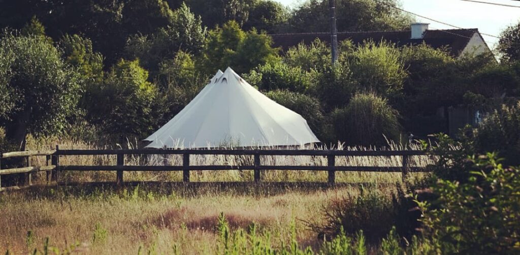 Autentic | Luxury Glamping Bell Tents - Two Desert 5m Major glamping bell tents set up by Canvas Nights in a grass field