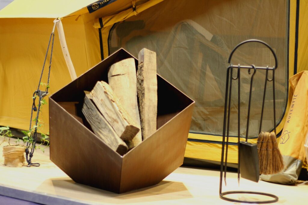 Autentic | Luxury Glamping Bell Tents - Eva Solo fire pit in front of the Autentic yellow Double Bell Tent