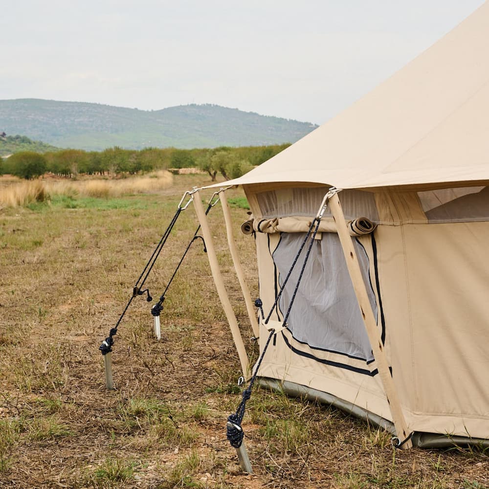 Autentic | Luxury Glamping Bell Tents - Wooden short guy poles reducing the tent footprint of the Autentic glamping bell tents