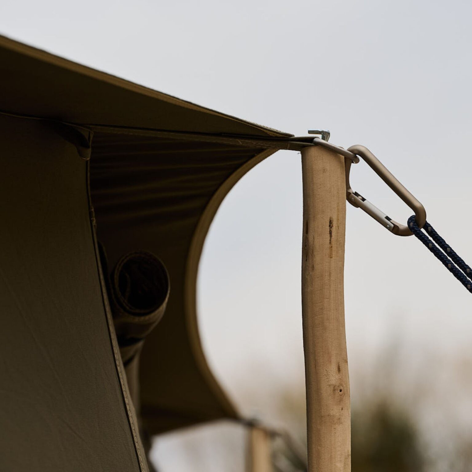 Autentic | Luxury Glamping Bell Tents - Detail of the eucalyptus short guy poles used to reduce the footprint of the Autentic glamping bell tents