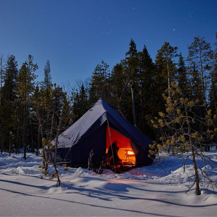 Autentic | Luxury Glamping Bell Tents - Blue 4m glamping bell tent during a winter camping trip in Finland