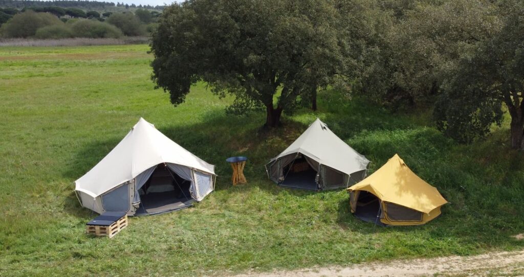 Autentic | Luxury Glamping Bell Tents - Drone shot of colourful glamping bell tents of Autentic set up by Glamping Revolution in Portugal