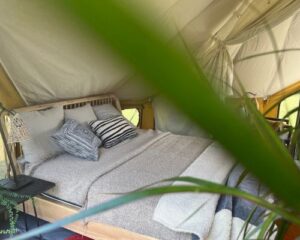 Autentic | Luxury Glamping Bell Tents - Ethnicraft bed in the Autentic Billy-Joe Double Bell Tent during the Antwerp Design Week