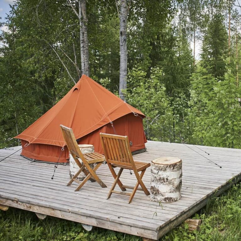 Autentic | Luxury Glamping Bell Tents - Roasted Pumpkin 3m cotton bell tent set up on a wooden platform at the Camp Kartano glamping site