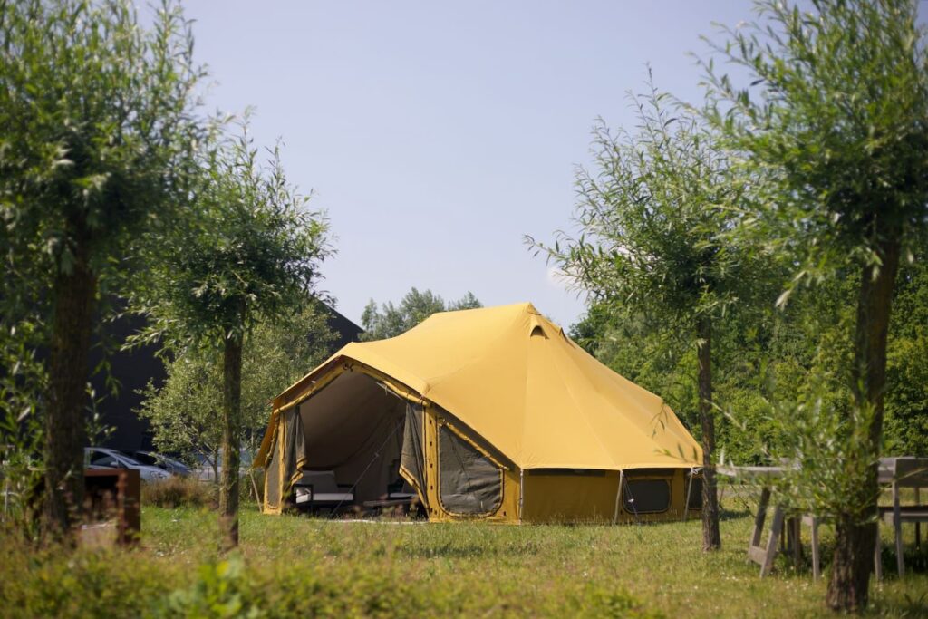 Autentic | Luxury Glamping Bell Tents - Autentic yellow Double Bell Tent set up at the Ethnicraft headquarters during the Antwerp Design Week