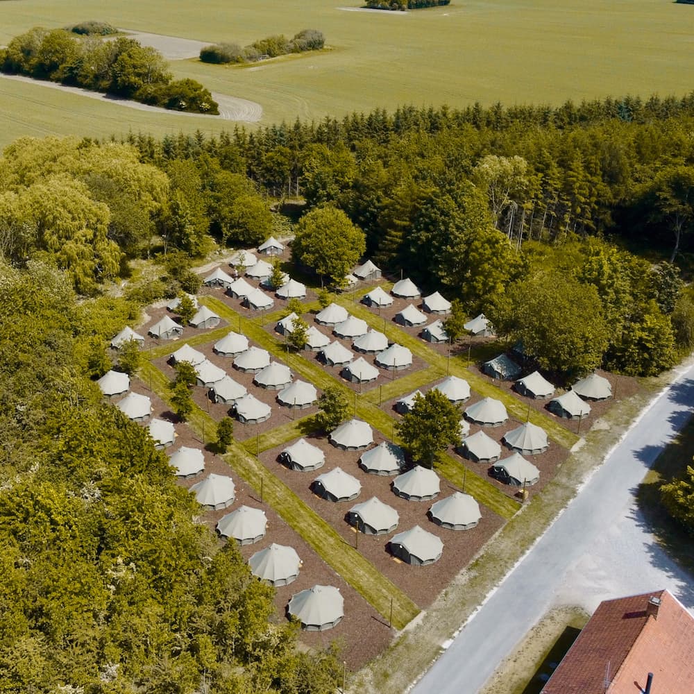 Autentic | Luxury Glamping Bell Tents - Drone view of Glamping site at Organic Concept in Denmark with Jack Bell Tents