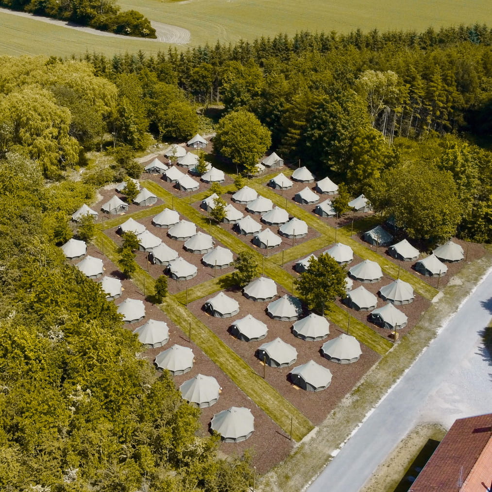 Autentic | Luxury Glamping Bell Tents - Drone view of Glamping site at Organic Concept in Denmark with Jack Bell Tents