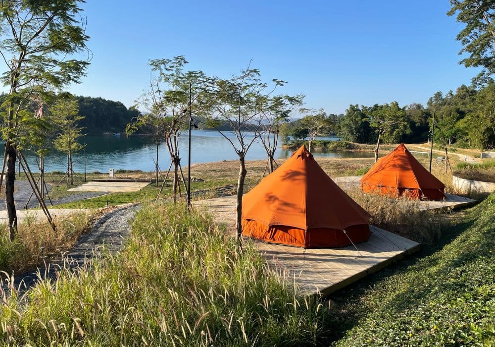 Autentic | Luxury Glamping Bell Tents - Two Autentic Jack Bell Tents set up on a wooden platform at Glamping Lake WanIv in China