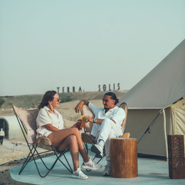 Autentic | Luxury Glamping Bell Tents - People enjoying a drink in front of a Jack Bell Tent 5.2 at Terra Solis in Dubai